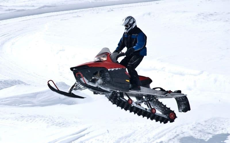 Snowmobiles use skis to steer and tracks for traction